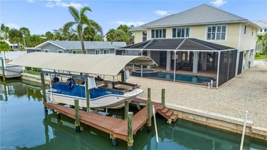 Welcome to your coastal paradise! This ELEVATED canal home with - photo 2