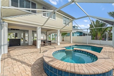 Welcome to your coastal paradise! This ELEVATED canal home with - photo 6