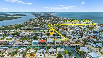 Welcome to your coastal paradise! This ELEVATED canal home with - photo 8