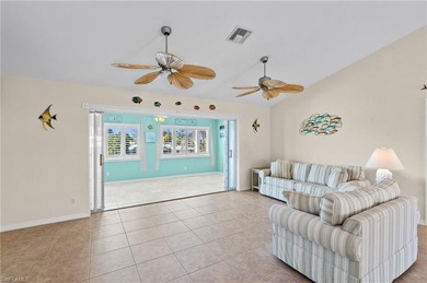 Welcome to your coastal paradise! This ELEVATED canal home with - photo 10