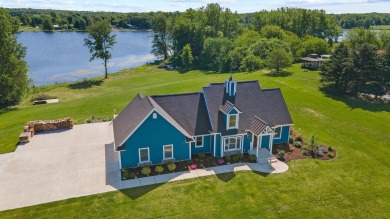 Wake up to panoramic sunrise views on Smalley Lake! The ultimate - Lake Home For Sale in Kimmell, Indiana