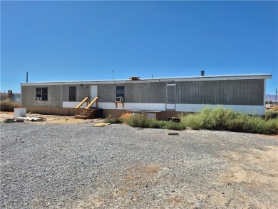 Fixer Upper with Huge Potential on 1.1 Acres in Pahrump!  Bring
