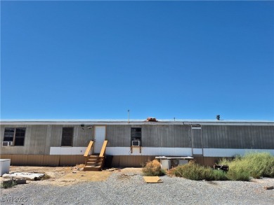 Fixer Upper with Huge Potential on 1.1 Acres in Pahrump!  Bring