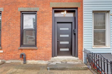 This attractive triplex has a beautifully restored facade that - photo 2