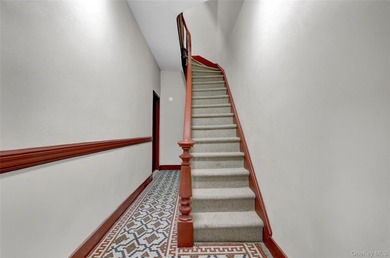 This attractive triplex has a beautifully restored facade that - photo 3