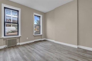 This attractive triplex has a beautifully restored facade that - photo 4