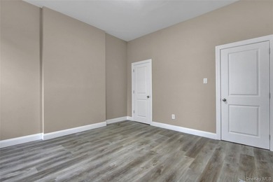 This attractive triplex has a beautifully restored facade that - photo 5