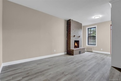 This attractive triplex has a beautifully restored facade that - photo 6