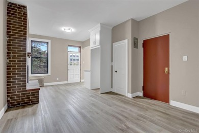 This attractive triplex has a beautifully restored facade that - photo 7