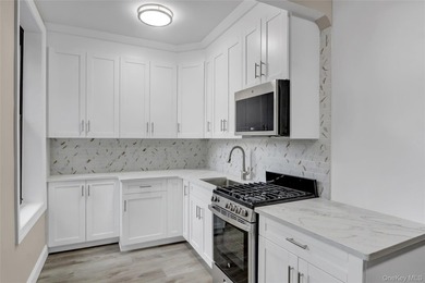 This attractive triplex has a beautifully restored facade that - photo 9
