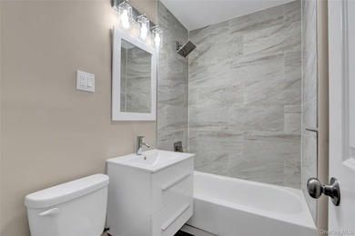 This attractive triplex has a beautifully restored facade that - photo 10