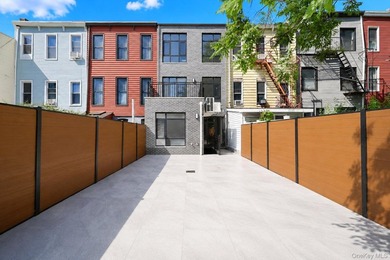 Welcome to this beautifully renovated two family home in the - photo 3