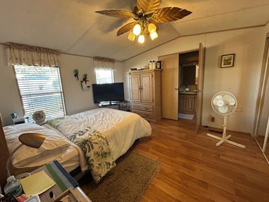This 1995 manufactured home features 2 bedrooms and 2 bathrooms - photo 9