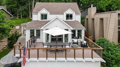 Welcome home to this incredible lake retreat in Lake Quivira! - photo 1