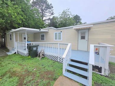 This charming 2-bedroom, 1-bath mobile home is located in a - photo 4