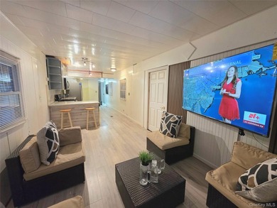 This charming 2-bedroom, 1-bath mobile home is located in a - photo 6