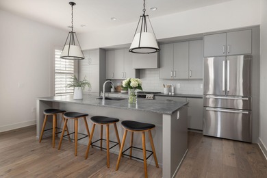 Welcome to this sun-filled two bedroom, two-and-a-half bath