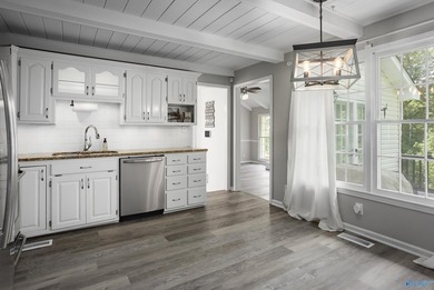 Enjoy lakefront living on Wilson Lake with 125' of waterfront, a - photo 9