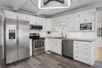 Enjoy lakefront living on Wilson Lake with 125' of waterfront, a - photo 10