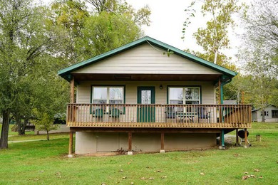 Here it is! Lakefront 2-bedroom, 1-bath cabin at Edgewater Beach - photo 1