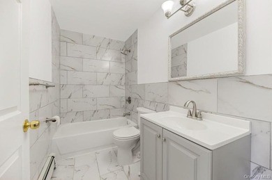 2084 Davidson Ave is a well maintained two family brick home in - photo 7