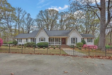 Welcome to this beautifully maintained ranch-style home nestled