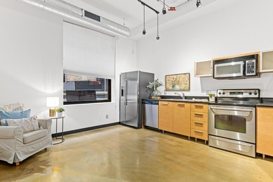 Welcome to the epitome of downtown living! The historic Lowry - photo 7