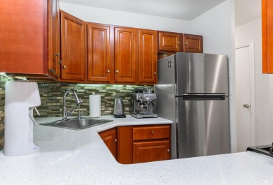 Enjoy easy living in this well-maintained 9th-floor condo at