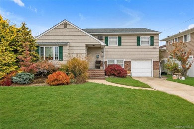 Welcome to this beautifully maintained split-level home located - photo 1