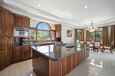 Nestled on over an acre of serene, private grounds in - photo 12