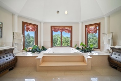 Nestled on over an acre of serene, private grounds in - photo 34