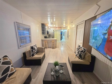 This charming 2-bedroom, 1-bath mobile home is located in a - photo 13