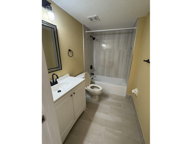 NEWLY RENOVATED KITCHEN. UPDATED BATHROOMS. NEW WINDOW - photo 5