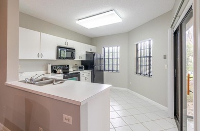 This 2 bedroom 2 bath condo offers the ease of first floor - photo 7