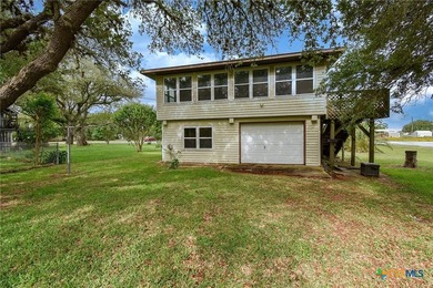 Bay breeze and shade trees await at 225 Swallow Dr. in gated - photo 38