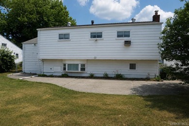 This split-level home in Lindenhurst features four spacious - photo 4