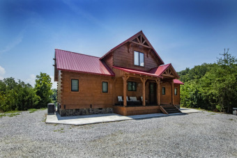A three bedroom, four bath log home on a peninsula Douglas Lake - Lake Home For Sale in Dandridge, Tennessee