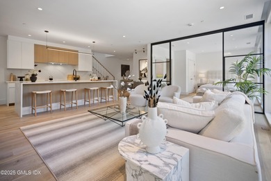 This impressive home has floor-to-ceiling windows, wood floors