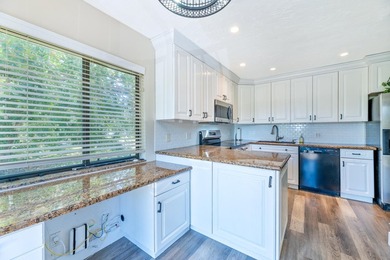 Welcome to this beautifully maintained two-story condominium in - photo 7