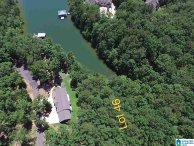 Beautiful view with the protection of a cove! This 1 acre Gentle - Lake Lot For Sale in Wedowee, Alabama