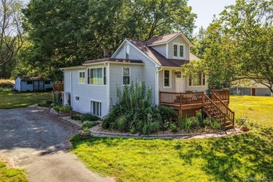 Set on 1.2 mostly-cleared acres in Lake Huntington, this updated - photo 3