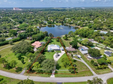 Lake Home For Sale in Palm Beach Gardens, Florida