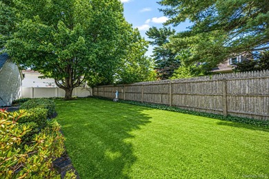 Welcome to this beautifully maintained expanded ranch in - photo 5