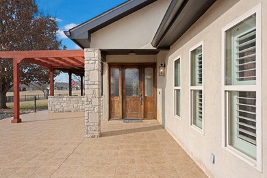 Experience refined Hill Country living in prestigious Comanche