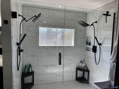 Welcome to this stunning 4 bedroom, 2.5 bathroom full brick home