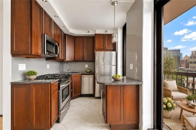 Perched on a high floor with breathtaking skyline views, this - photo 3