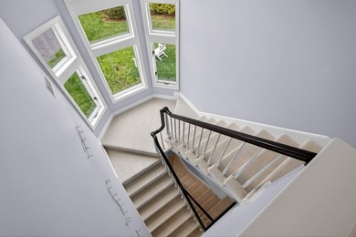 Set on 2.5 acres within the coveted Wings Neck community, this - photo 31
