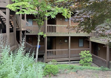 Enjoy lake living at its finest in this beautifully situated - photo 1