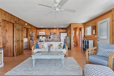 Tucked away in a secluded waterfront setting, this charming - photo 13