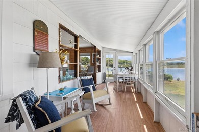 Tucked away in a secluded waterfront setting, this charming - photo 16